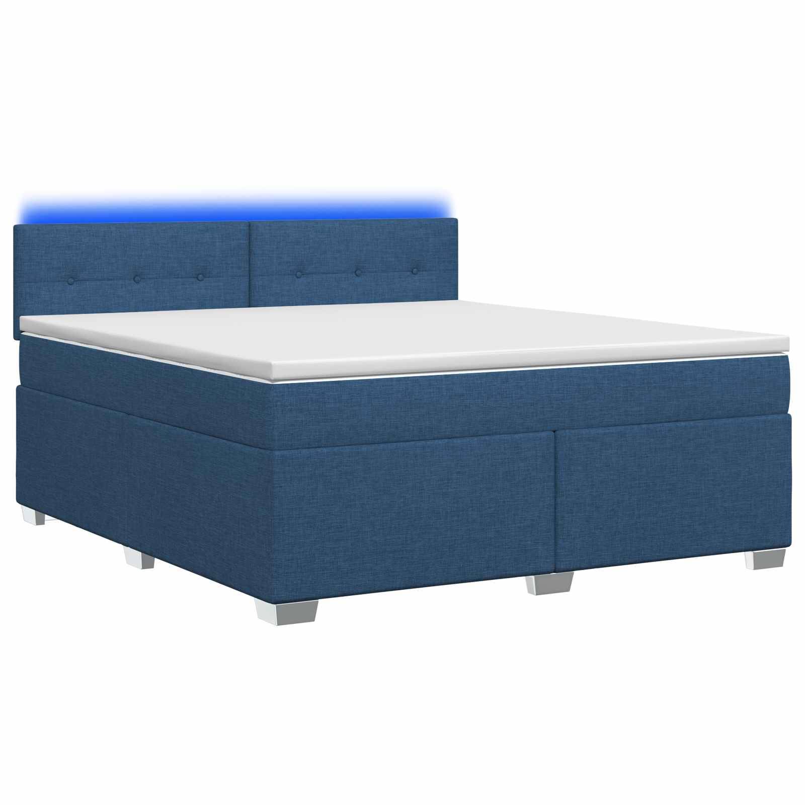 Blau gepolstertes Boxspringbett mit weißer Matratze und gestepptem Kopfteil auf weißem Hintergrund