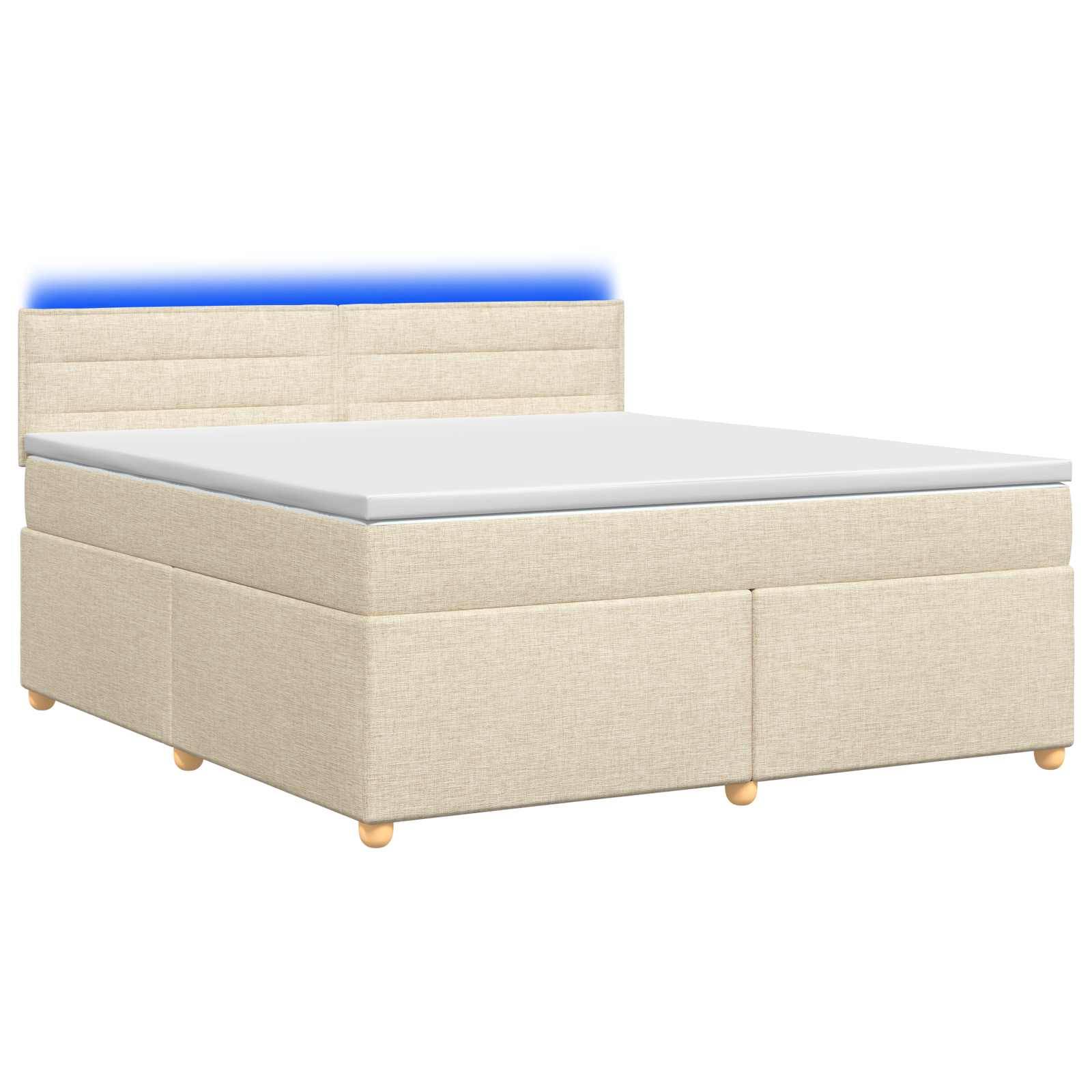Beige gepolstertes Bett mit Kopfteil und Matratze auf weißem Hintergrund, beleuchtet durch eine blaue Akzentbeleuchtung hinter dem Kopfteil.