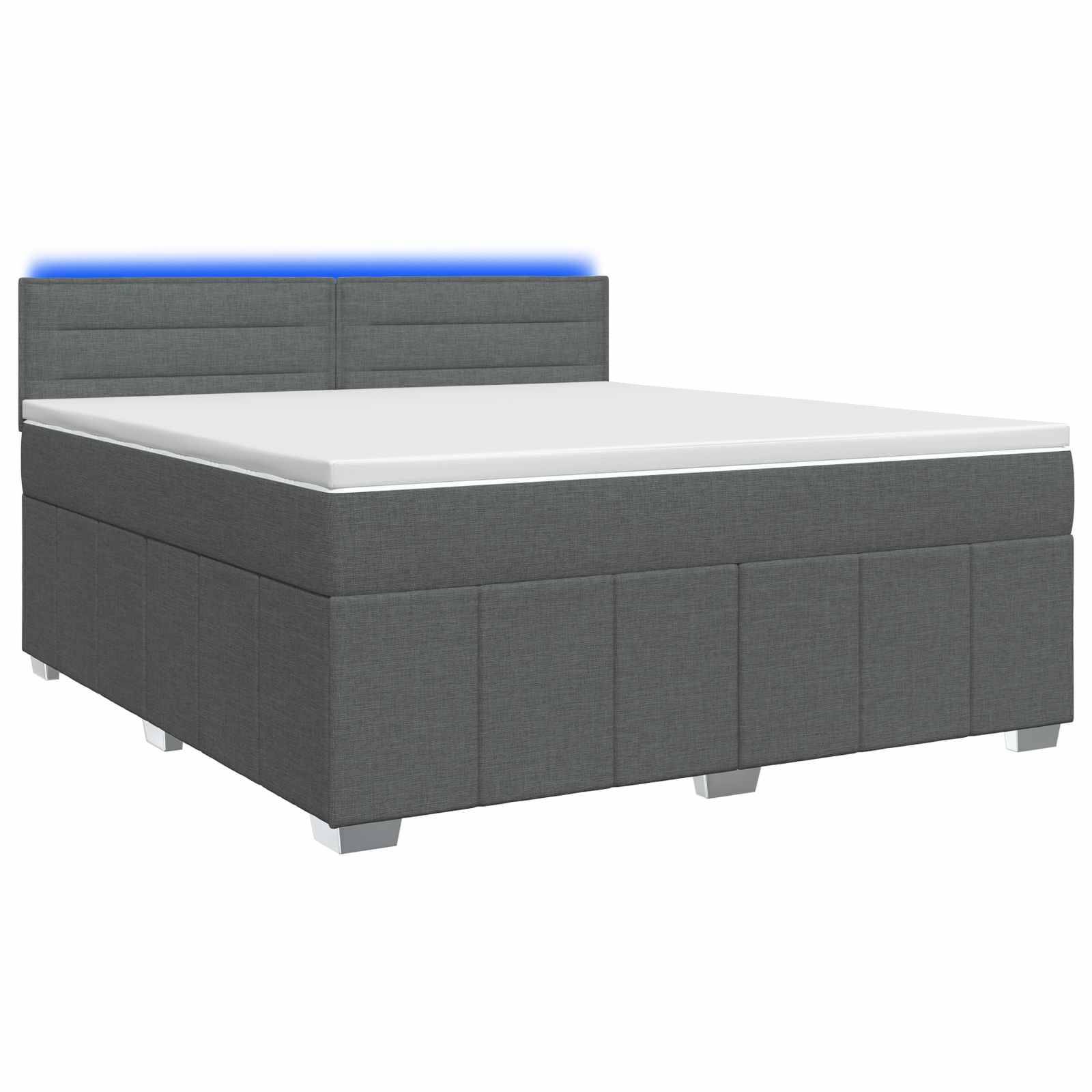 Grau gepolstertes Bett mit weißer Matratze und gepolstertem Kopfteil auf weißem Hintergrund.