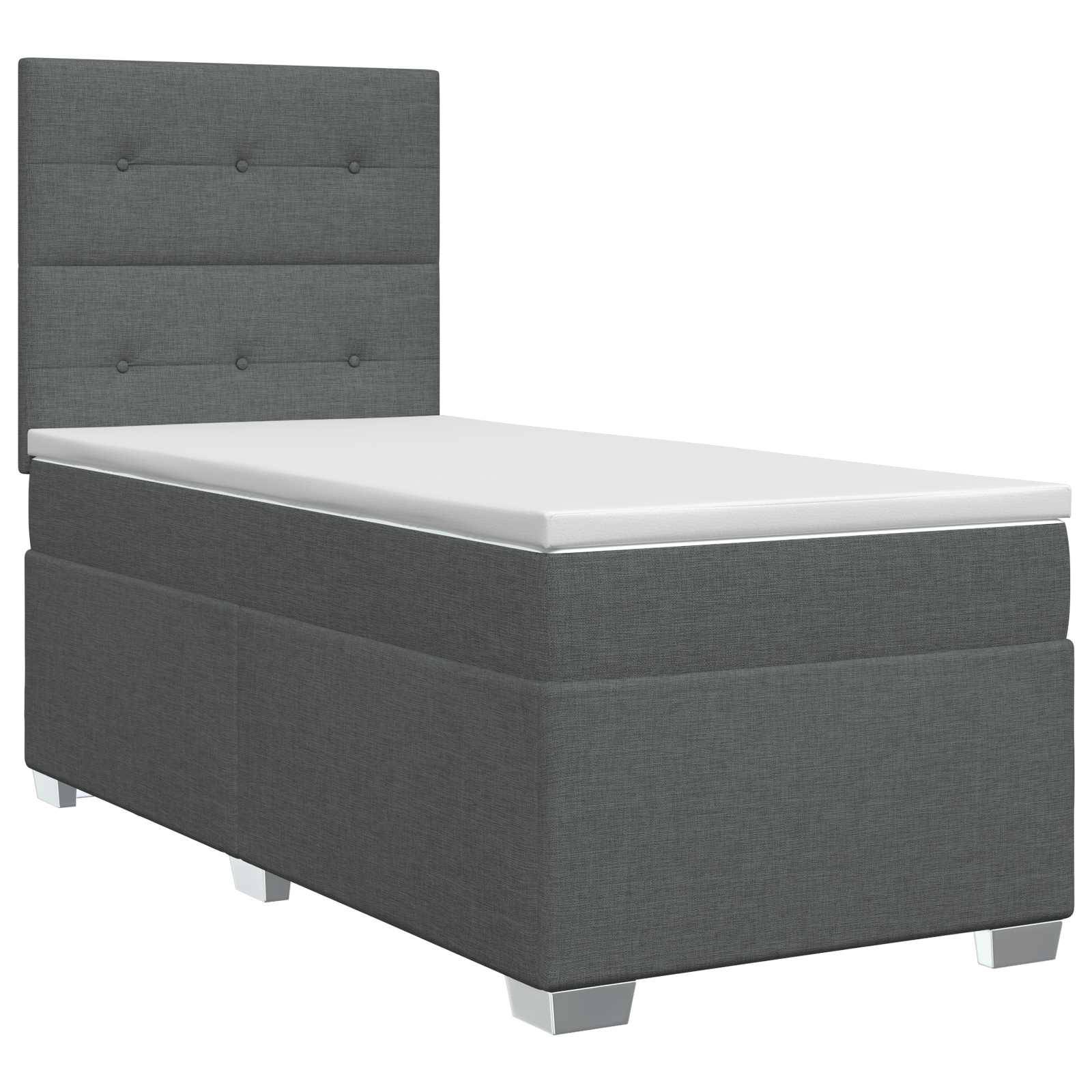 Graugepolstertes Einzelbett mit gestepptem Kopfteil mit Knöpfen, weiße Matratze und niedrige Beine auf neutralem Hintergrund.