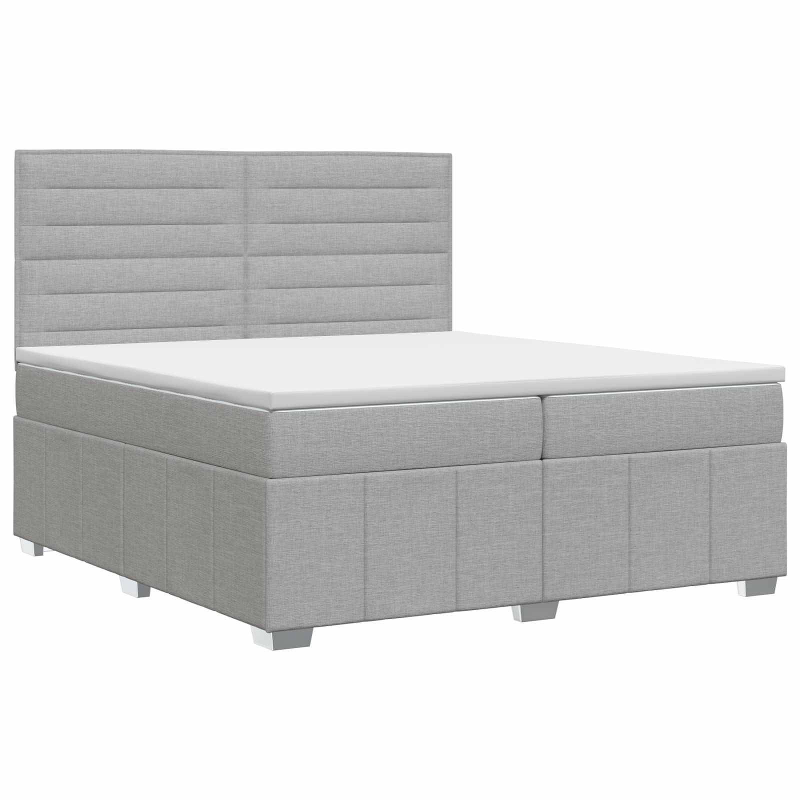 Grau gepolstertes Bett mit Kopfteil und Sockel, dargestellt mit einer weißen Matratze auf einfachem weißem Hintergrund.
