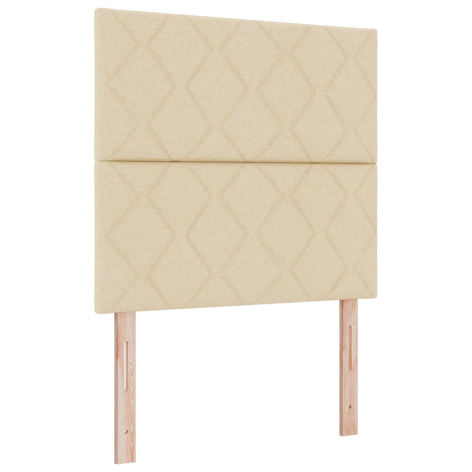 Gepolstertes beige gepolstertes Kopfteil mit zwei Holzbeinen auf weißem Hintergrund.