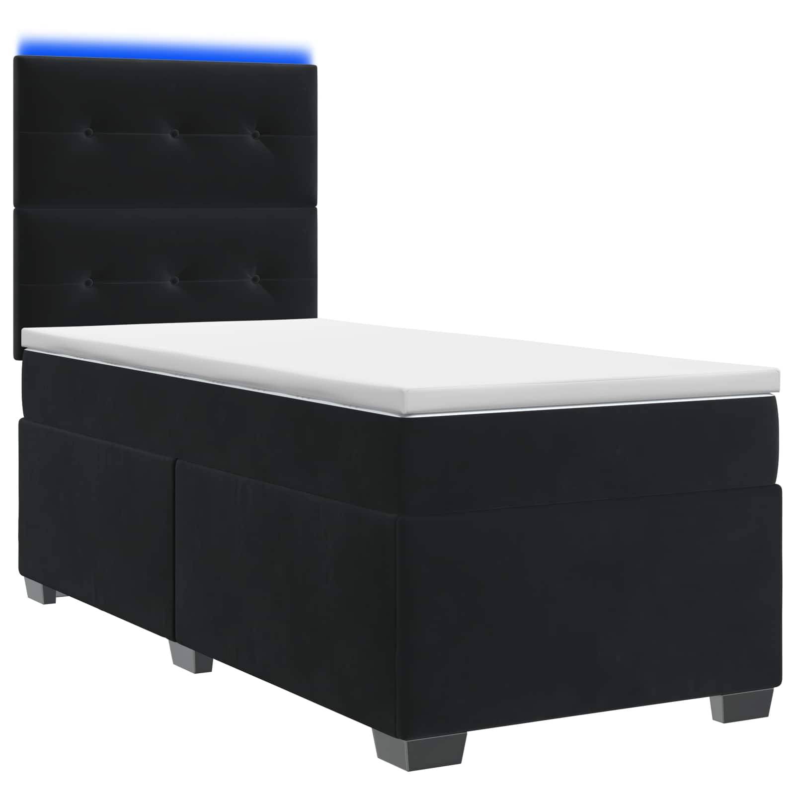 Schwarzes gepolstertes Einzelbett mit weißer Matratze und hohem Kopfteil, das oben von einem blauen Streifen beleuchtet wird, vor weißem Hintergrund dargestellt.