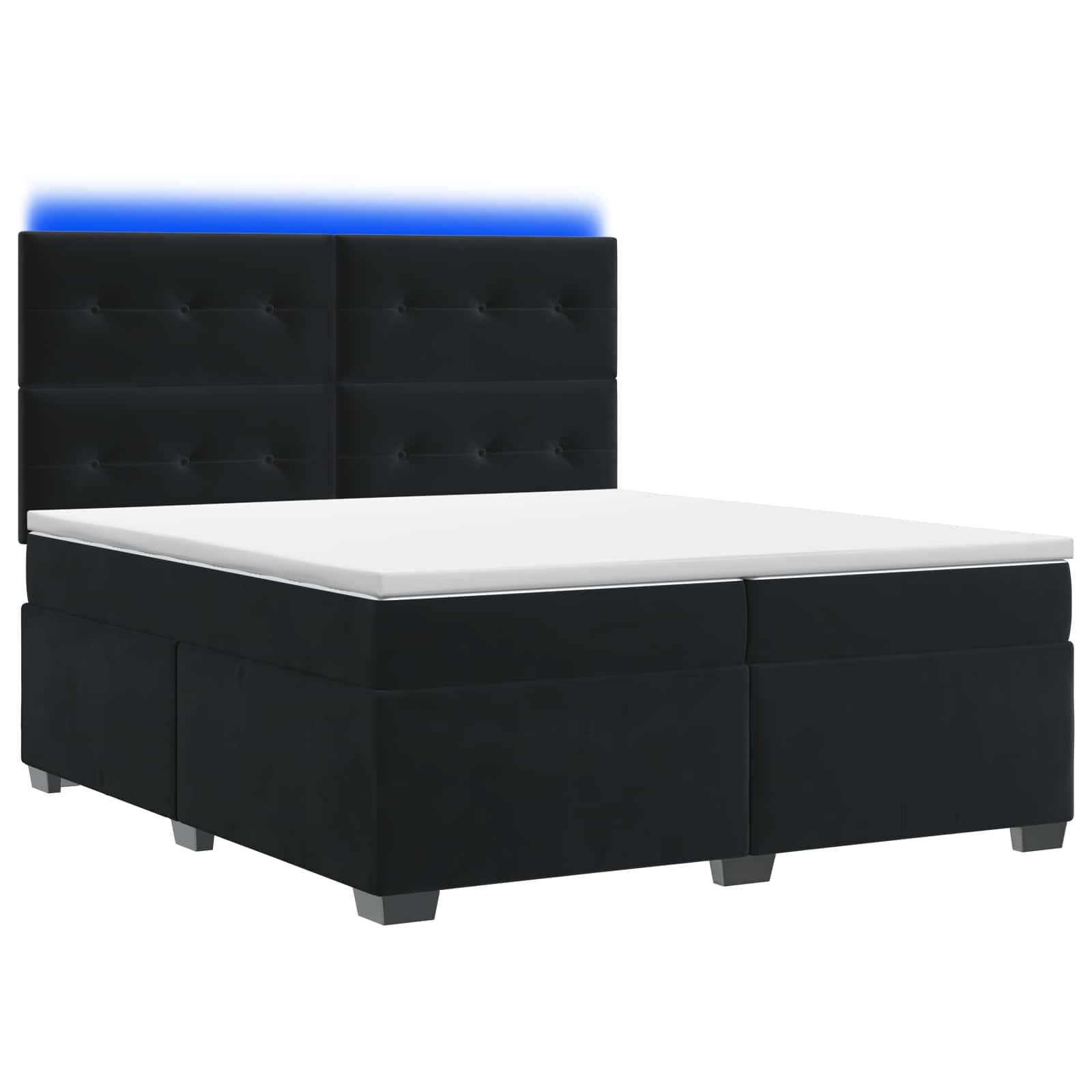 Schwarzes gepolstertes Bett mit Stauraum, gestepptem Kopfteil, weißem Matratzentopper und dezenter blauer LED-Leiste hinter dem Kopfteil.