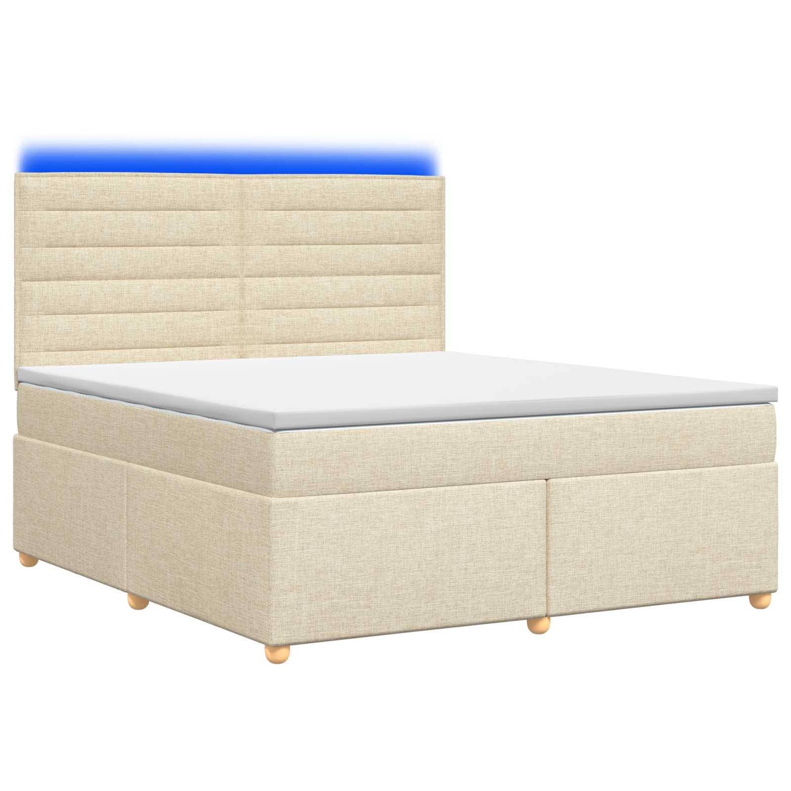 Beige gepolstertes Bett mit gepolstertem Kopfteil, weißer Matratze und verborgenem Stauraum auf weißem Hintergrund.