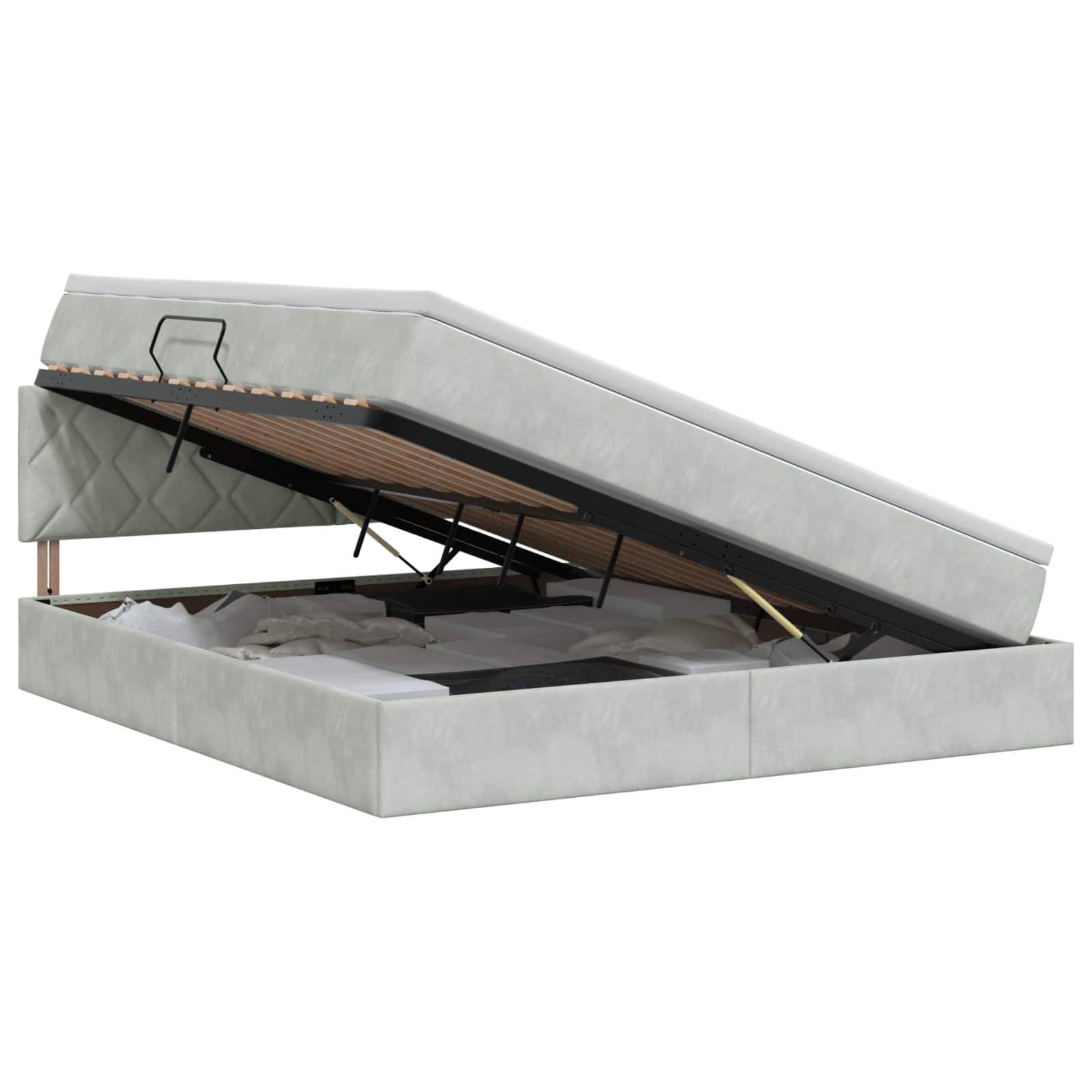 Gepolstertes Speicherbett mit aufgeklappter Matratze, das ein Unter-Bett-Fach und einen Metallstützrahmen zeigt.