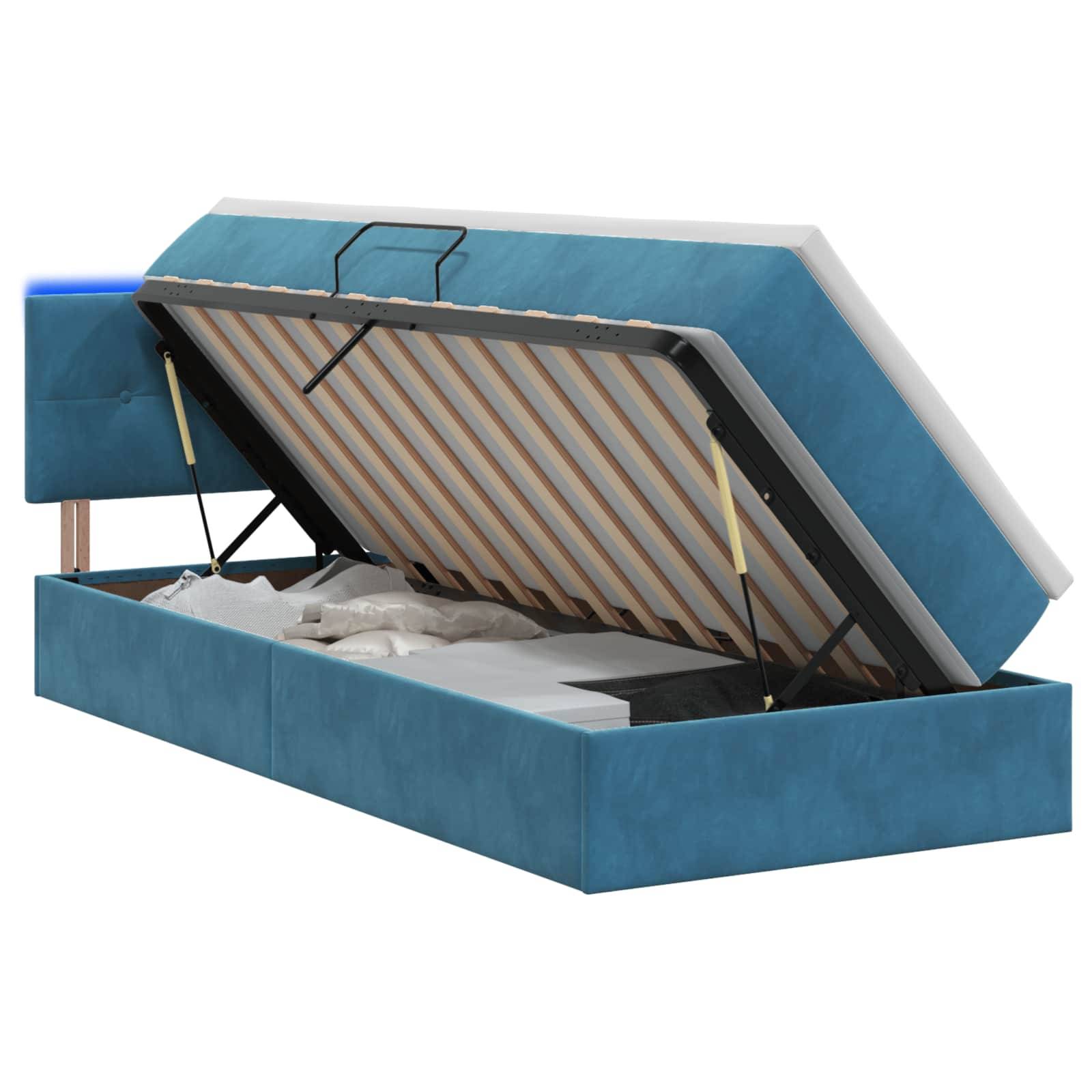 Bett mit blauem Polsterbezug und Hubmatratzenplattform mit Unterbettablage