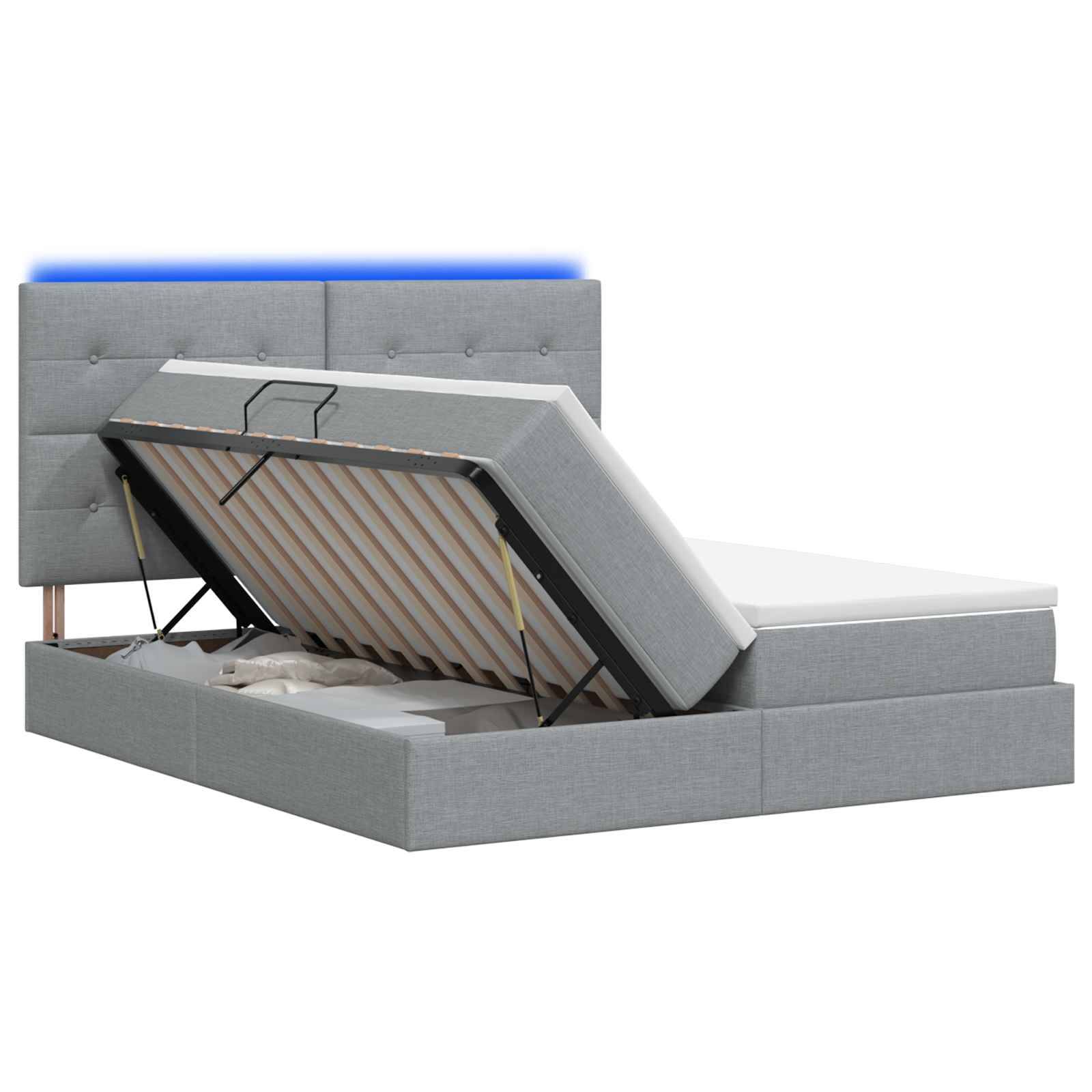 Grau gepolstertes Speicherbett mit angehobener Matratze auf hydraulischer Basis, das das Stauraum-Fach unter dem Bett zeigt.