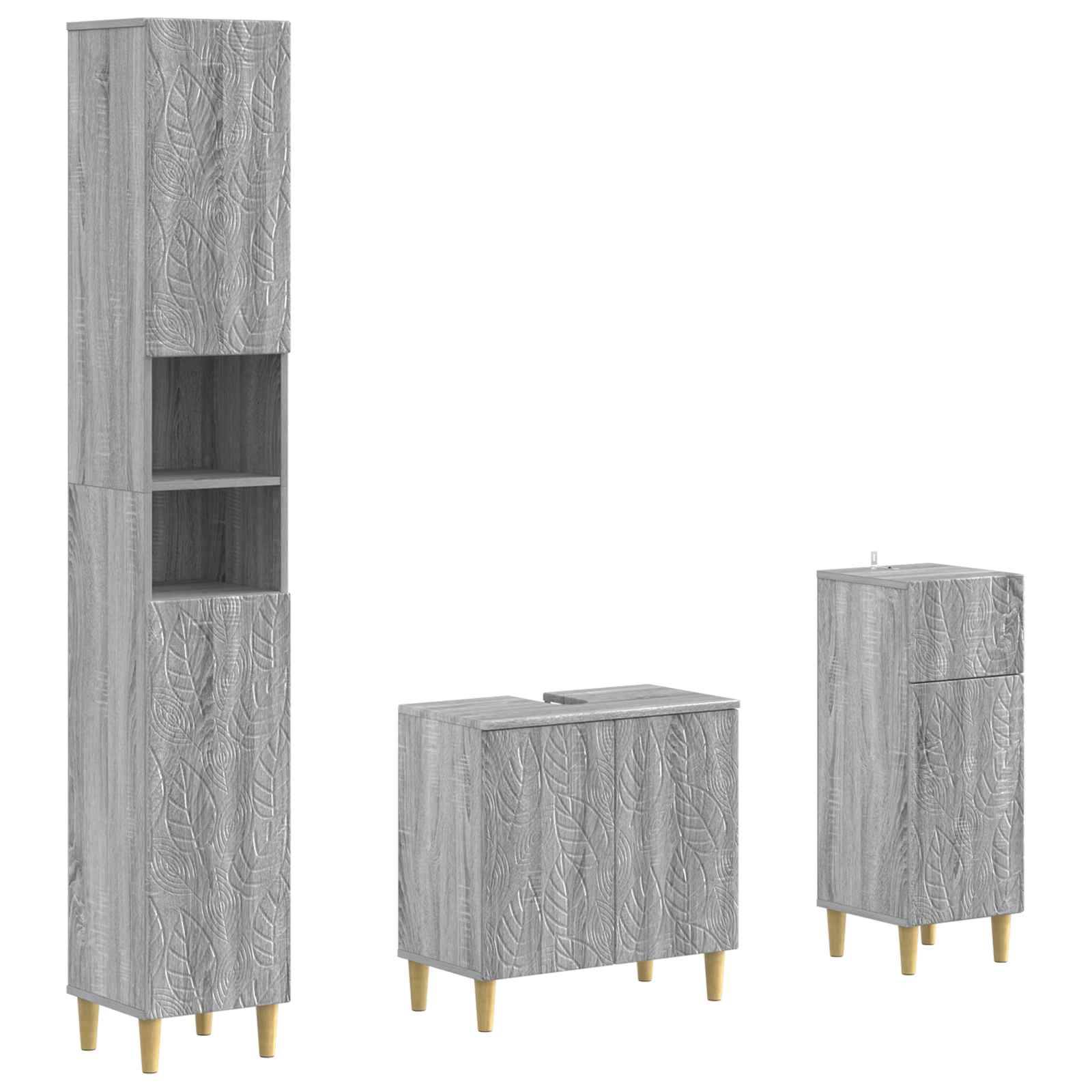 Drei Speicherschränke mit grauer Holzmaserung und goldenen Beinen: ein hoher Schrank mit offenen Regalen, ein niedriger Schrank und ein schmaler Schrank.
