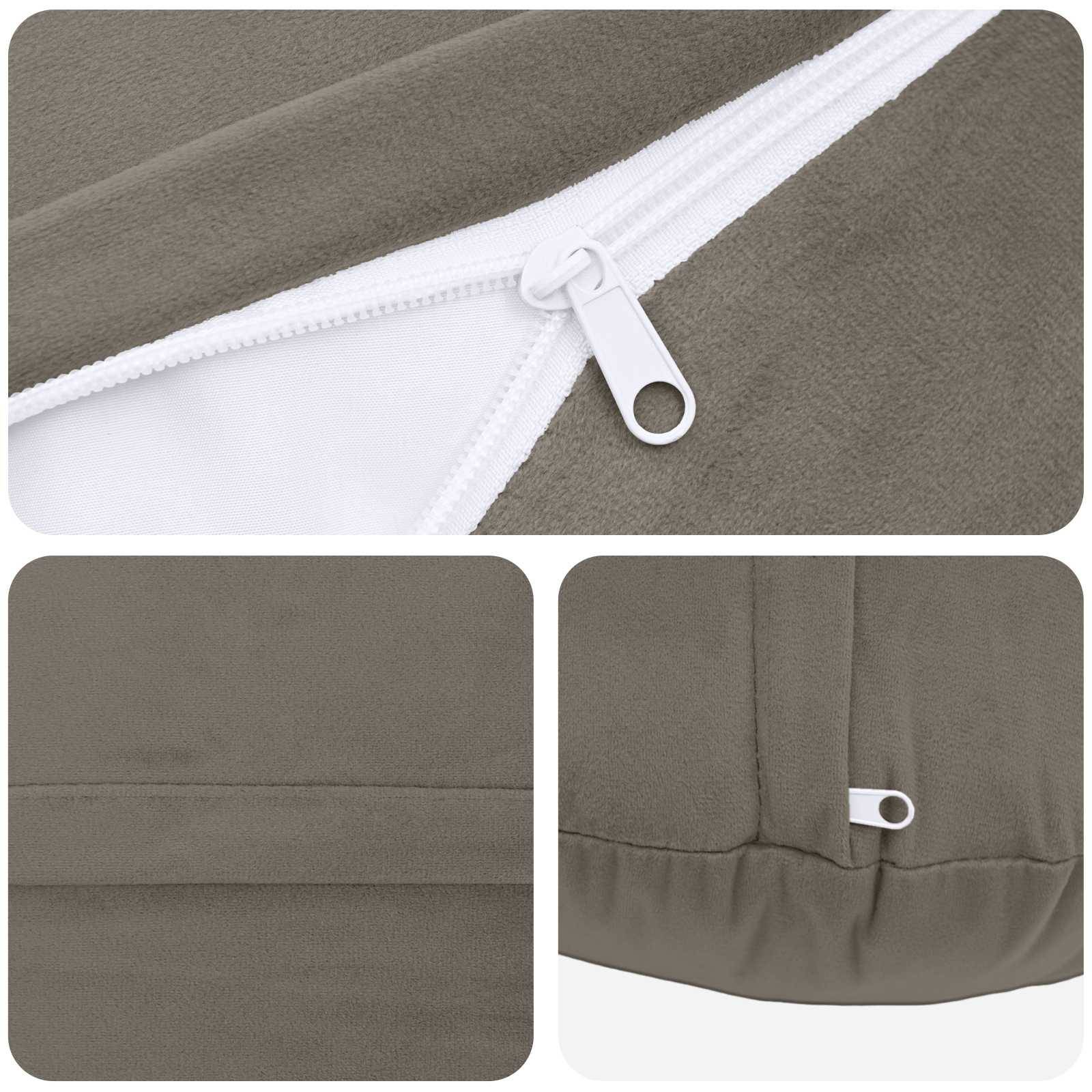 Nahaufnahmen eines Produktbildes eines olivgrünen Kleidungsstücks, das einen weißen Reißverschluss und Saumdetails zeigt, einschließlich Nähten und einer kleinen Zuglasche.