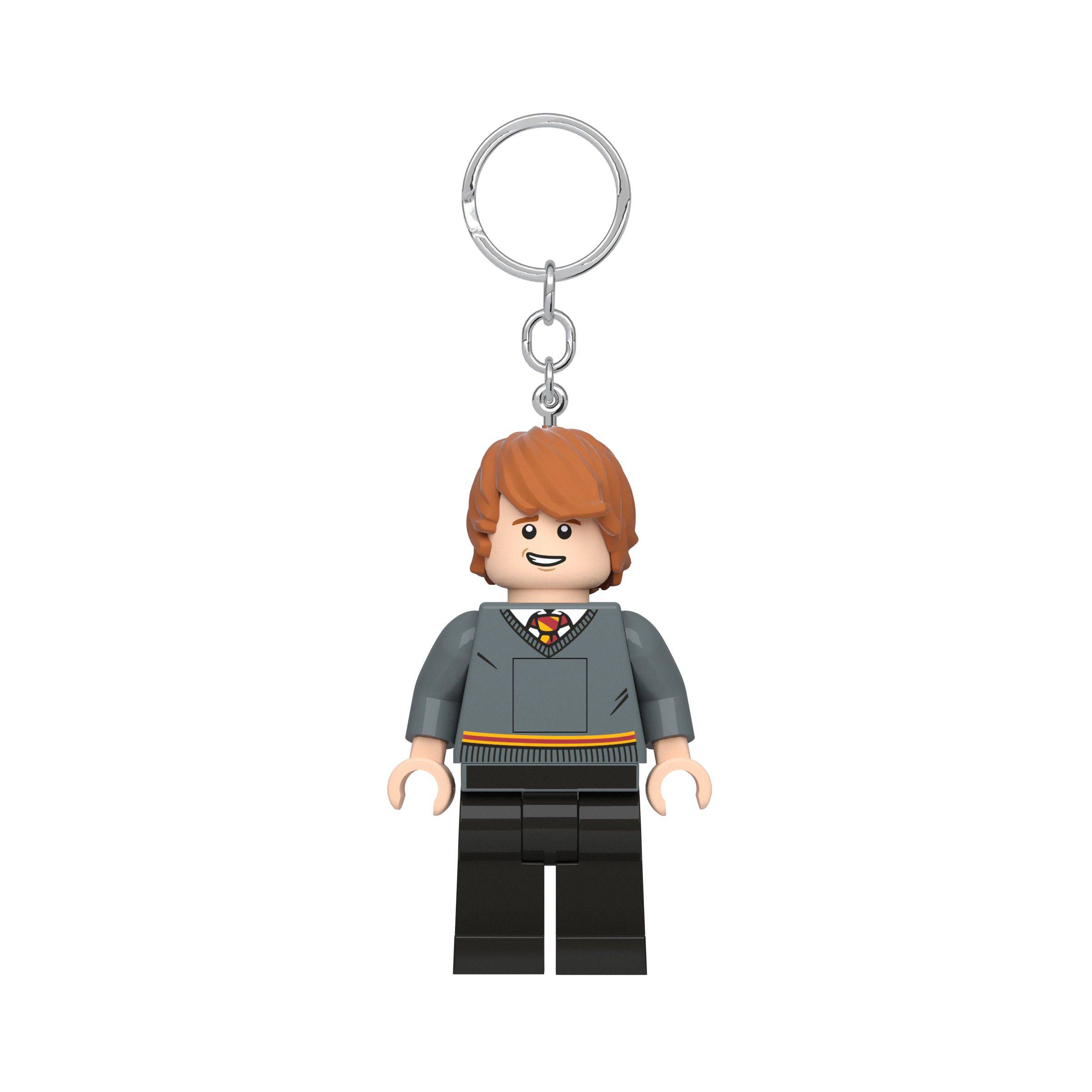 LEGO-ähnliche Harry-Potter-Schlüsselanhängerfigur mit grauem Pullover, schwarzer Hose und Metallringbefestigung auf weißem Hintergrund
