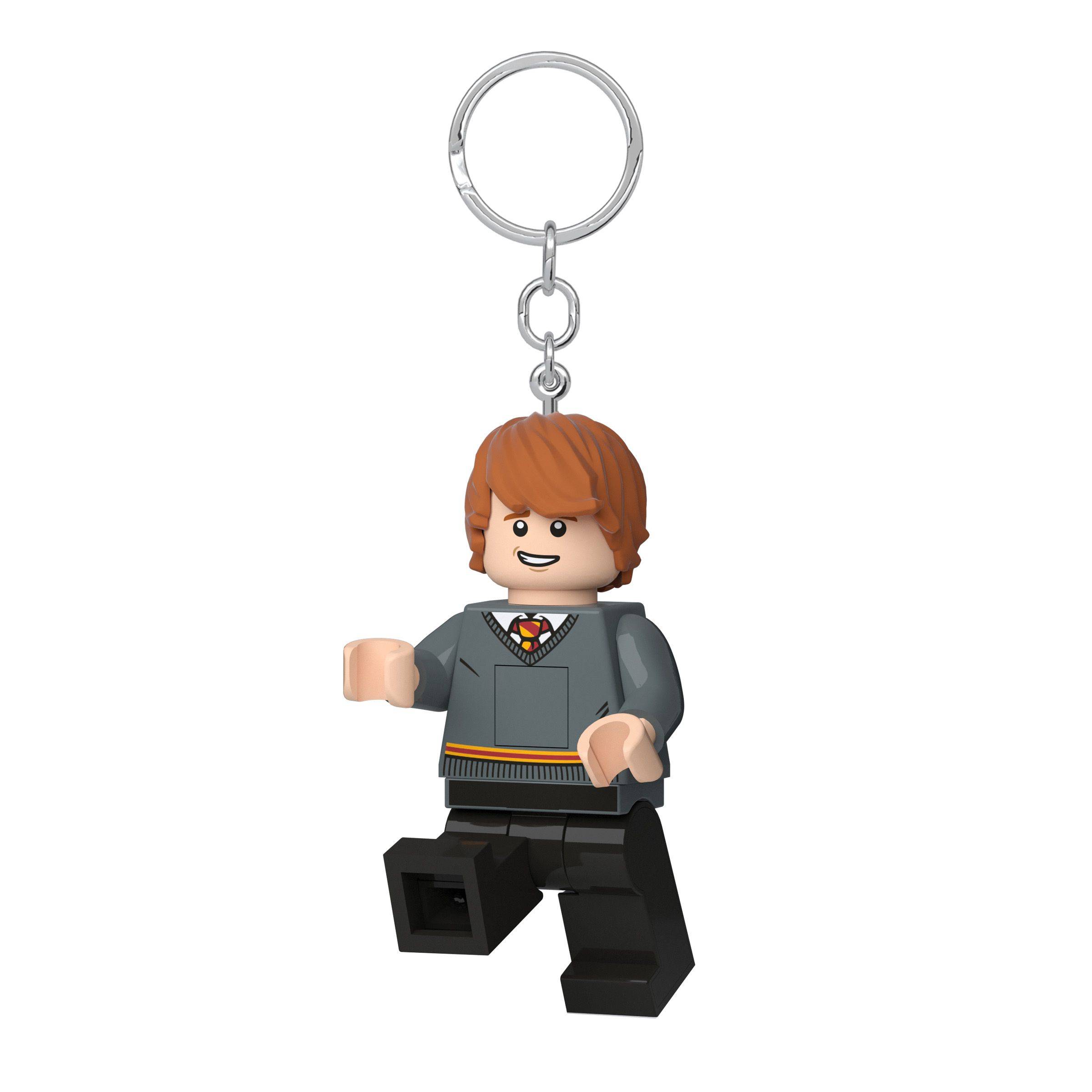 Ein LEGO-ähnliches Harry-Potter-Minifiguren-Schlüsselanhänger mit einem Metallring, das eine Figur in grauen Schulroben auf weißem Hintergrund zeigt.
