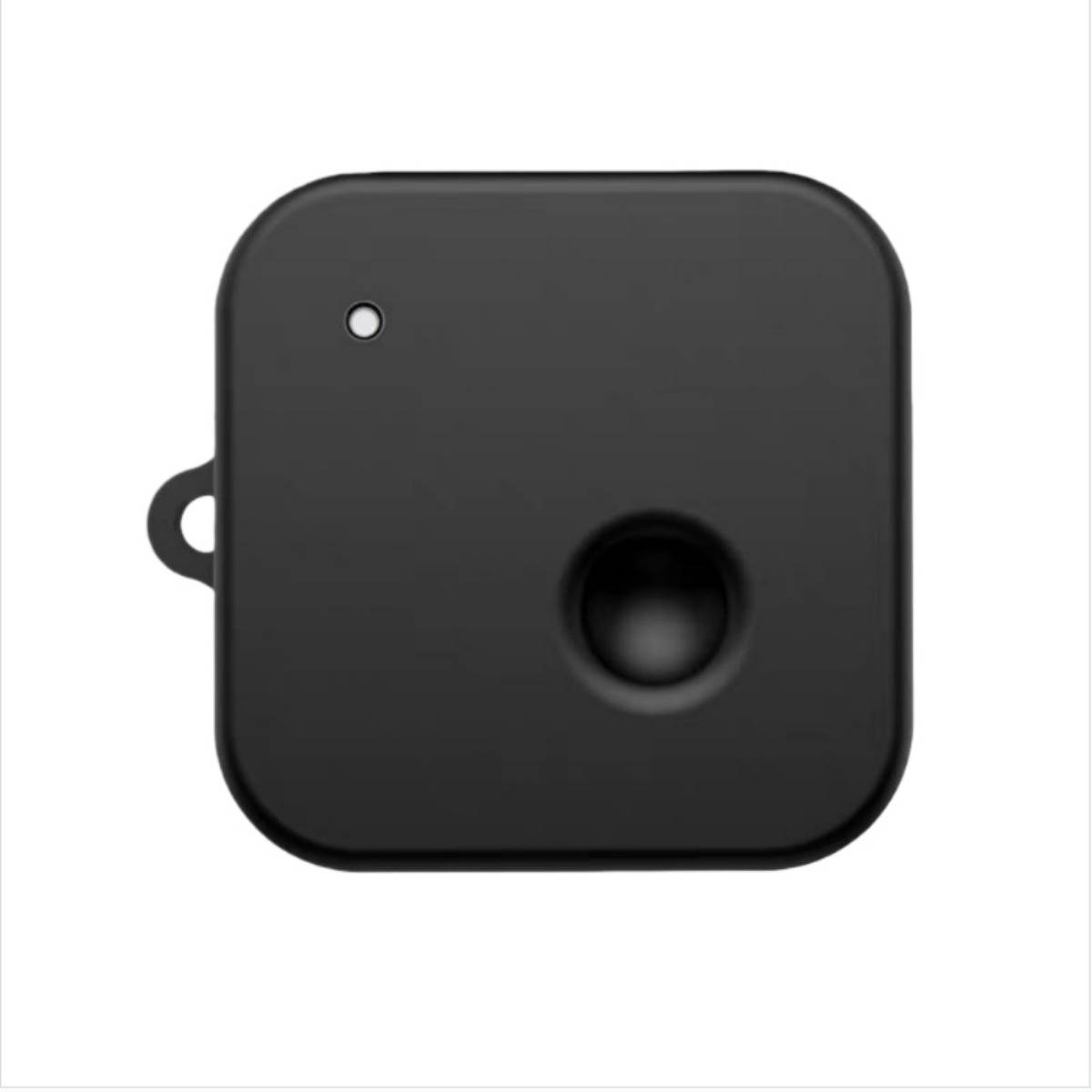 Schwarzes elektronisches Gerät mit quadratischer Form und abgerundeten Ecken, ein kleines Anzeigelicht, eine seitliche Schlaufe und ein kreisförmiger vertiefter Knopf oder Sensor.