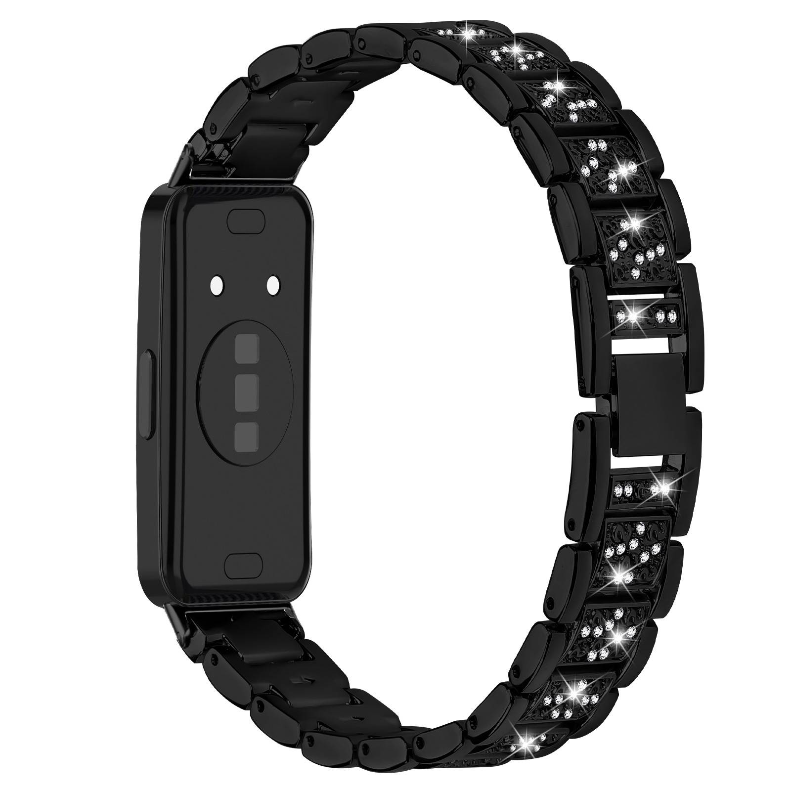 Schwarzes Fitness-Tracker-Armband mit einem rechteckigen Sensormodul und glitzernden dekorativen Gliedern am Armband.