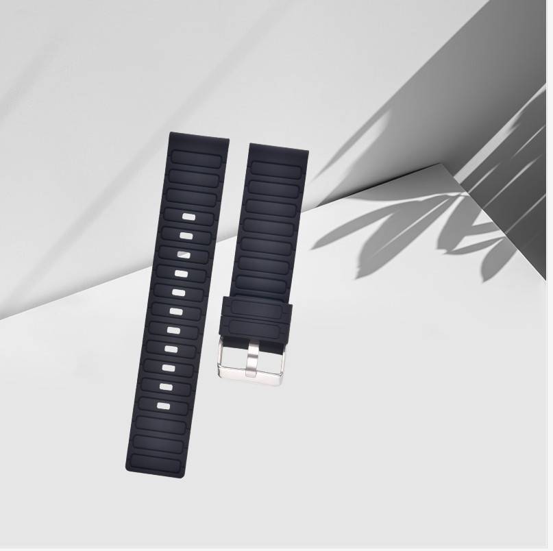 Zwei schwarze Uhrenarmbänder mit rechteckigen Ausschnitten und silbernen Schnallen auf einer weißen Oberfläche, gezeigt mit weichen Blattschatten.