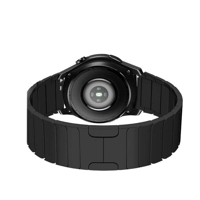 Schwarze runde Smartwatch von hinten gezeigt, mit Hervorhebung des kreisförmigen Sensors und des breiten segmentierten Armbands auf weißem Hintergrund.
