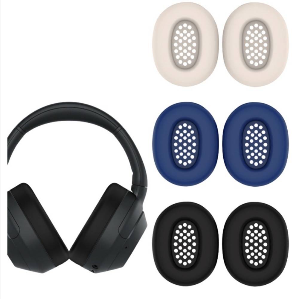 Schwarze Over-Ear-Kopfhörer mit sechs Ersatz-Ohrpolstern in Beige, Blau und Schwarz auf weißem Hintergrund.