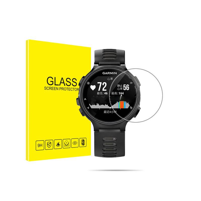 Schwarze Garmin-Smartwatch mit rundem Glaschutzfolie neben gelber Verpackung mit der Aufschrift „GLASS SCREEN PROTECTOR