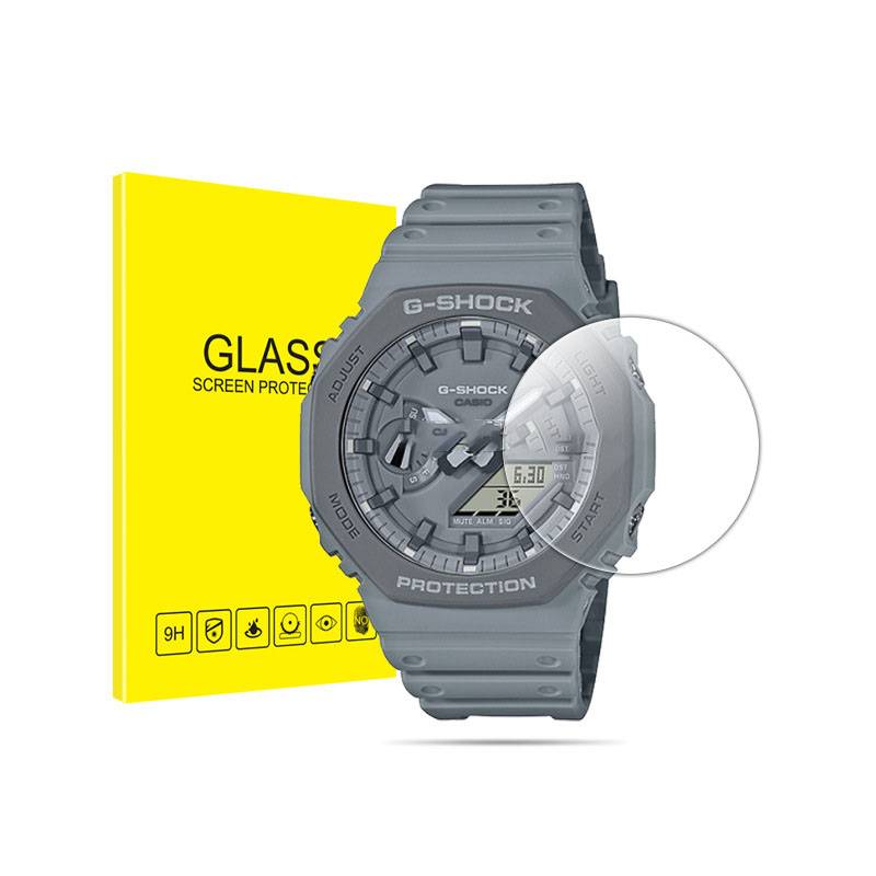 Graue G-SHOCK-Uhr neben einer gelben Box mit der Aufschrift 