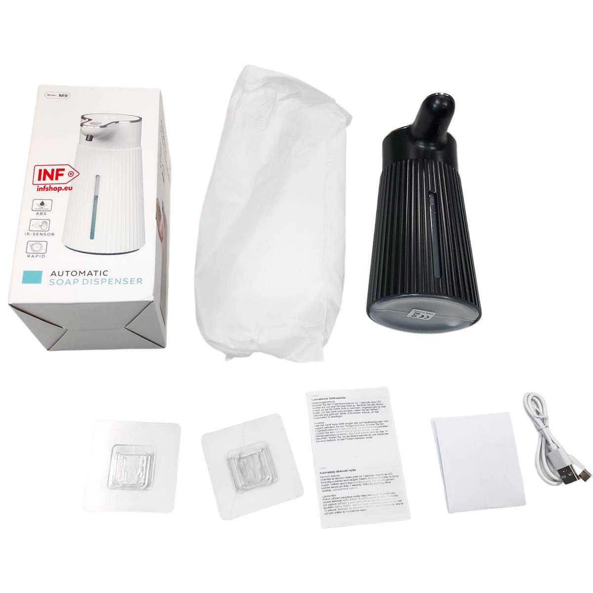 Ausgepacktes automatisches Seifenspender-Set mit Karton, verpacktem Spender, Bedienungsanleitung, zwei Klebepads und USB-Ladekabel auf weißem Hintergrund angeordnet.
