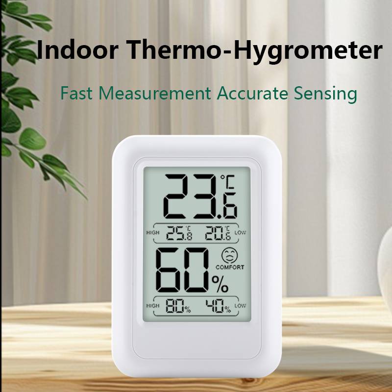 Ein digitales Thermo-Hygrometer auf einem Tisch zeigt 23,6°C und 60% Luftfeuchtigkeit an, mit dem Text „Schnelle Messung – genaue Erfassung