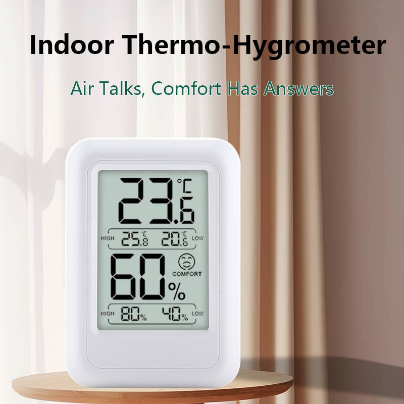Innen-Thermo-Hygrometer auf einem Tisch zeigt 23,6°C und 60% Luftfeuchte an, mit dem Status „Komfort