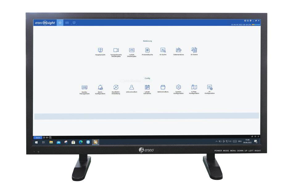 Ein Desktop-Monitor zeigt einen Geschäftssoftware-Startbildschirm mit Reihen von App-Symbolen und Beschriftungen auf einer überwiegend weißen Benutzeroberfläche.