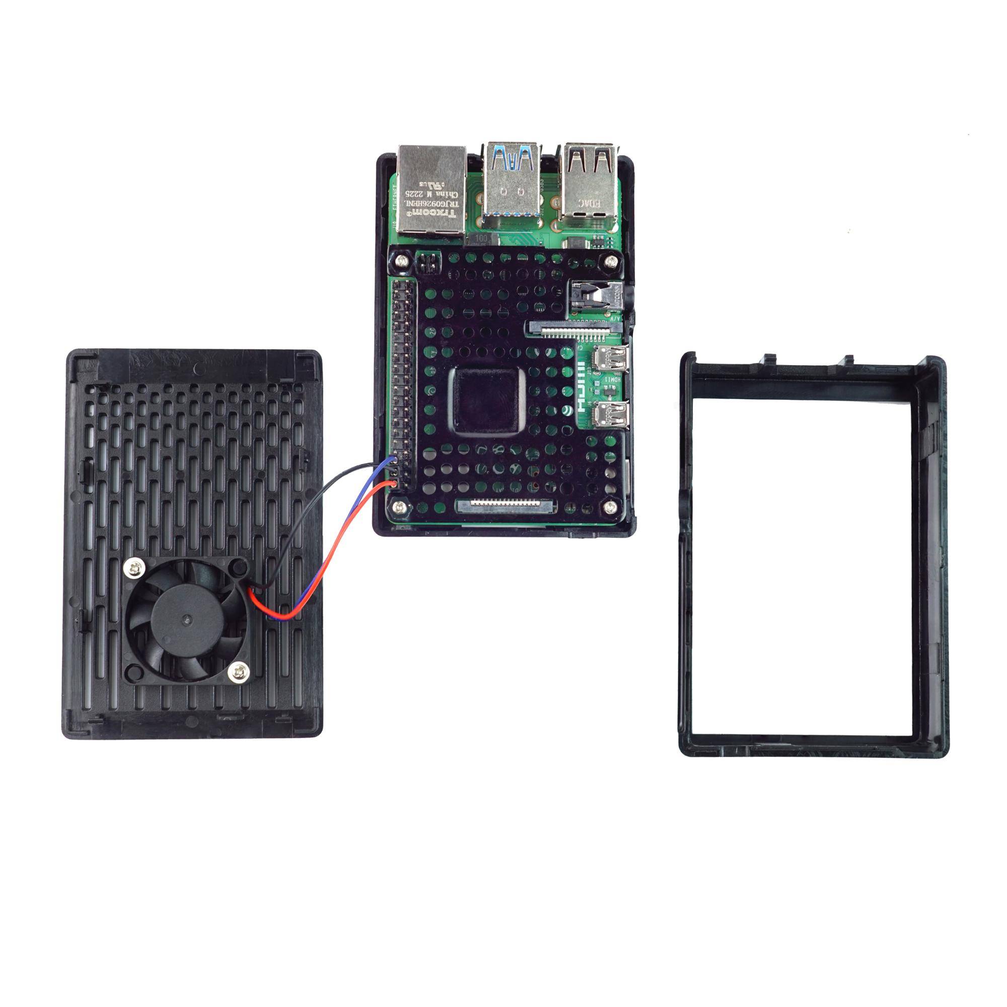 Zerlegtes kleines Computerboard mit Kühlgehäuse und separater Frontblende auf weißem Hintergrund, zeigt Anschlüsse, Lüfter und Verkabelung.