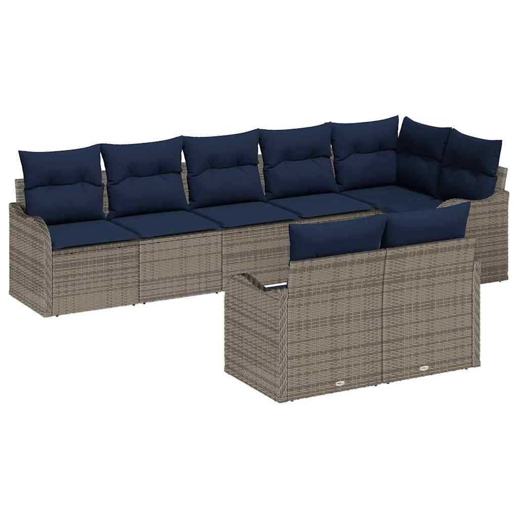Modulare Außensektional-Couch mit marineblauen Kissen und geflochtenem beigem Rattanrahmen, einschließlich einer passenden Ottomane/Fußstütze davor.