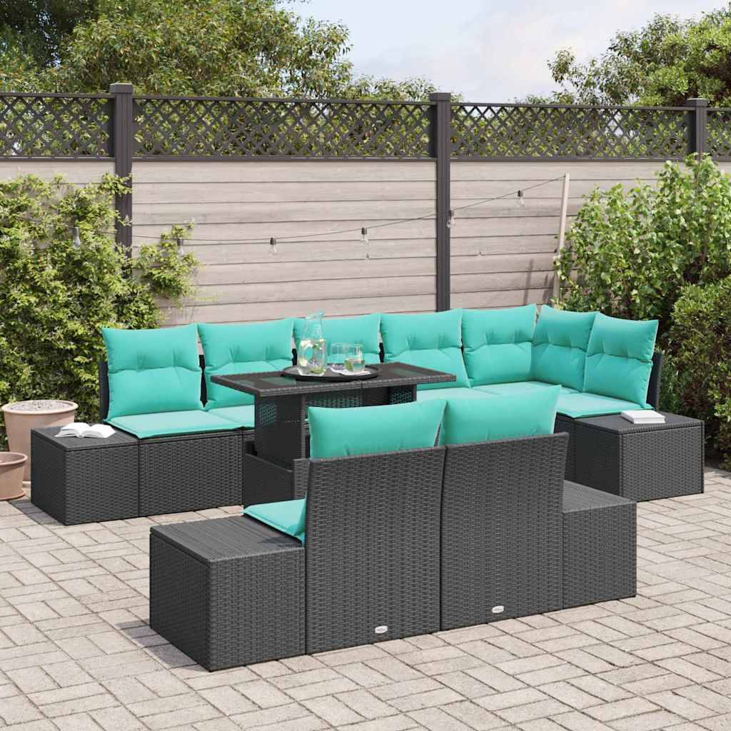 Sitzmöbel-Set für die Terrasse mit schwarzen Korbsesseln in Modulform, türkisenen Kissen und einem quadratischen Tisch auf einer gepflasterten Gartenveranda.