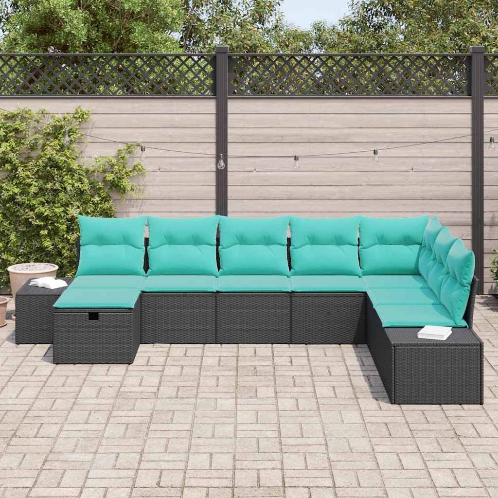 Outdoor-Patio-Ecksofa aus schwarzem Rattan mit türkisfarbenen Kissen, in L-Form gegen einen Zaun auf einer gepflasterten Terrasse angeordnet.