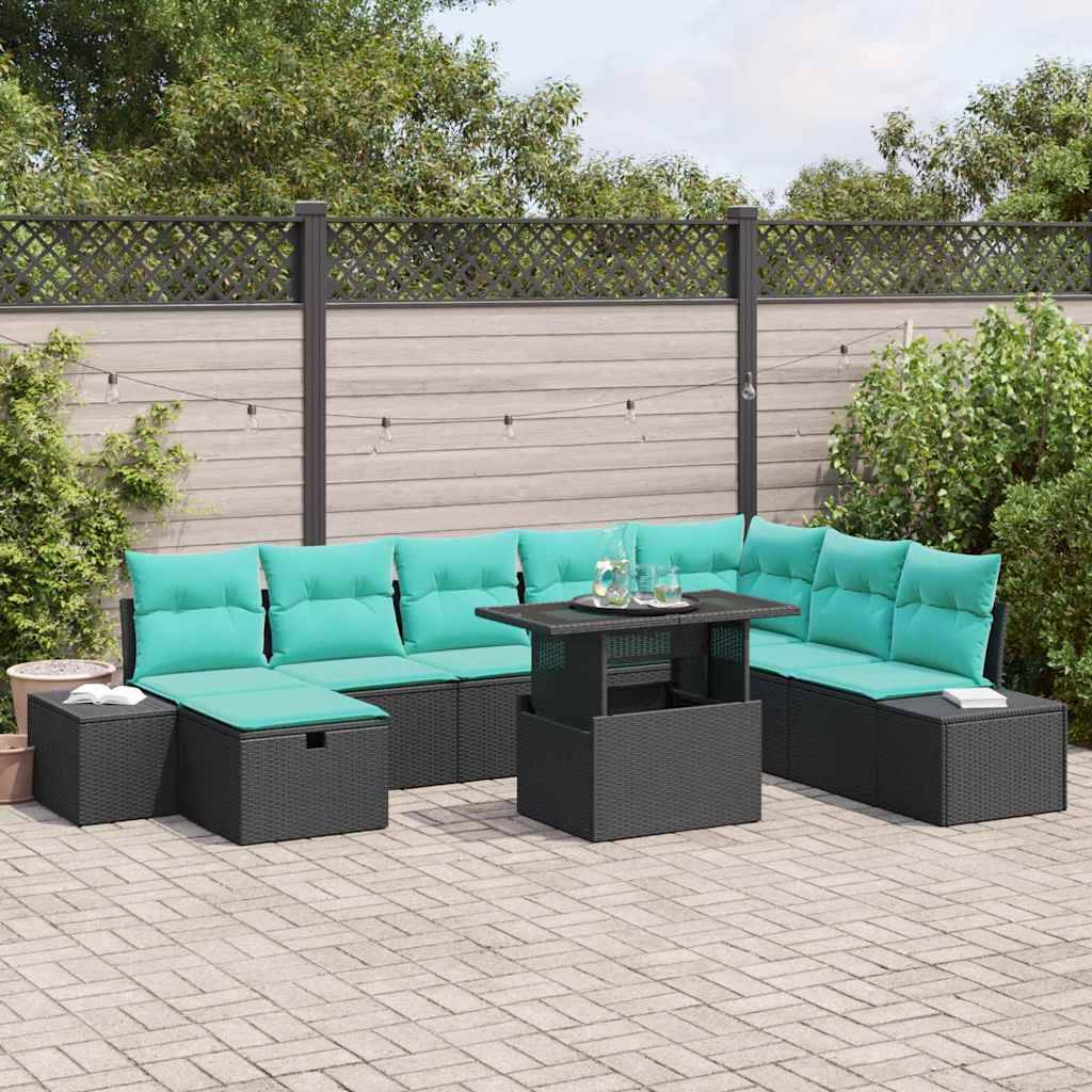 Außenpatio mit schwarzer Rattan-L-förmiger Eckgarnitur, türkisfarbenen Kissen und passendem Couchtisch auf einer gepflasterten Terrasse.