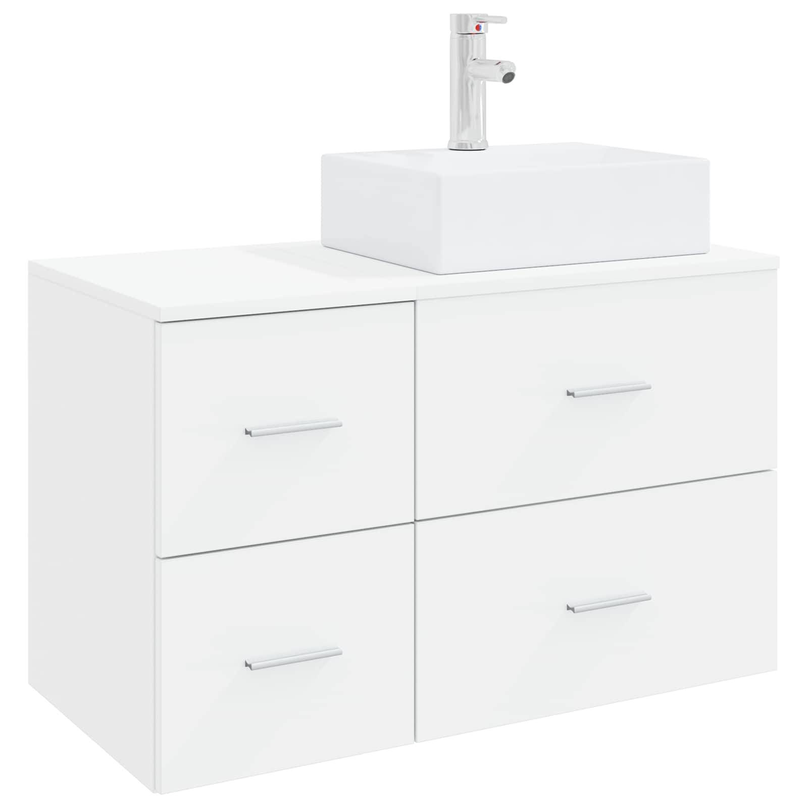 Weißer Badezimmerschrank mit vier Schubladen und einem rechteckigen Aufsatzwaschbecken, das von einem einfachen Wasserhahn gekrönt wird.