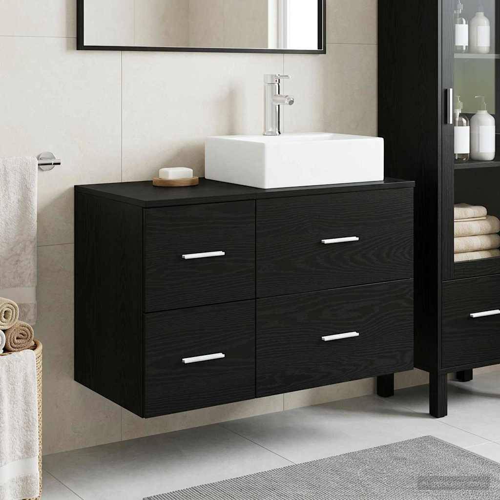 Modernes Badezimmer-Waschtisch mit schwarzem wandmontiertem Schrank, weißem Aufsatzbecken und Spiegel darüber; Regale und Handtücher in der Nähe.