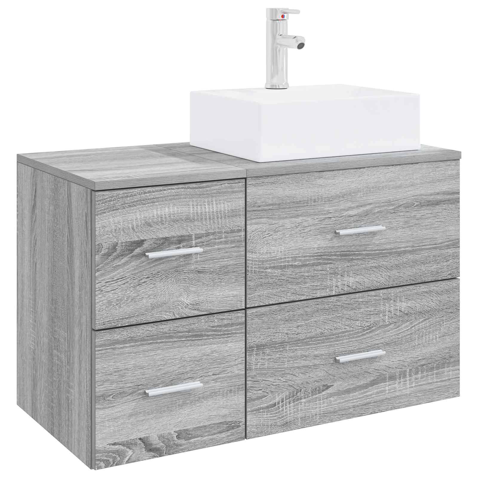 Grauer Holz-Badezimmerschrank mit vier Schubladen und einem weißen Aufsatzbecken oben drauf.