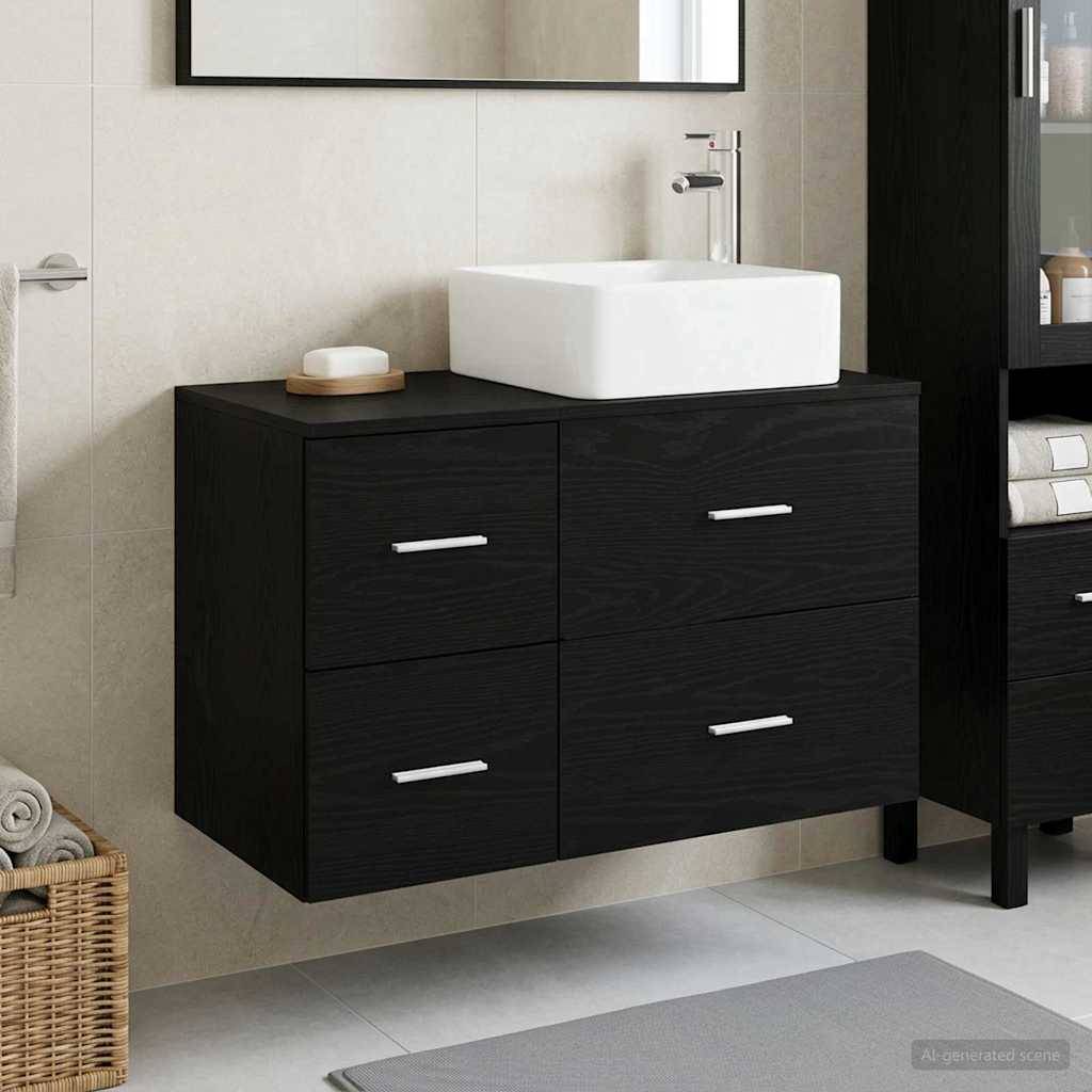 Modernes Badezimmerwaschtisch mit einem weißen Aufsatzwaschbecken auf einem schwarz wandmontierten Schrank mit vier Schubladen und Chromgriffen.