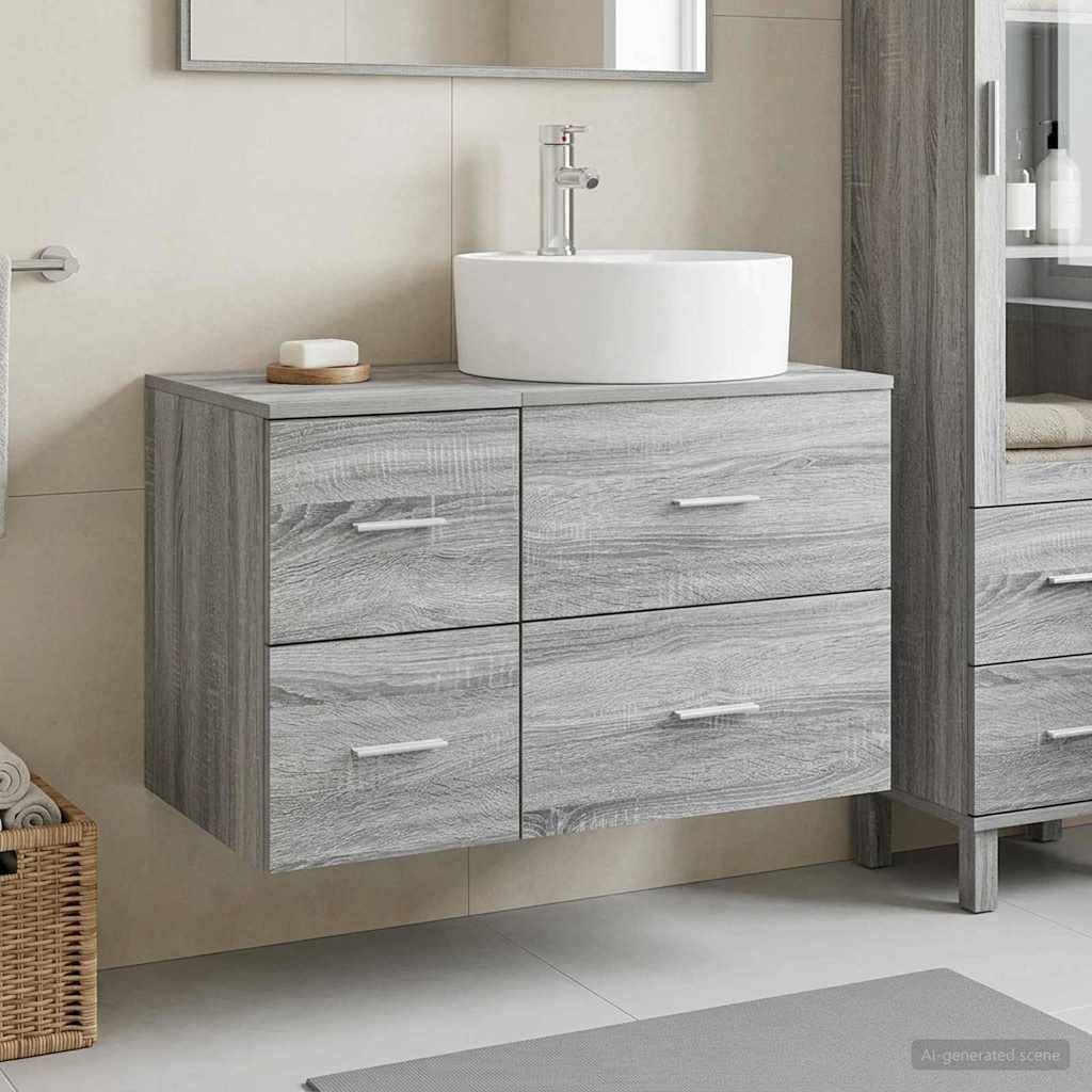 Modernes Badezimmerwaschbecken aus grauem Holz mit weißem Aufsatzwaschbecken, wandmontiert unter einem Spiegel, neben passendem Schrank.