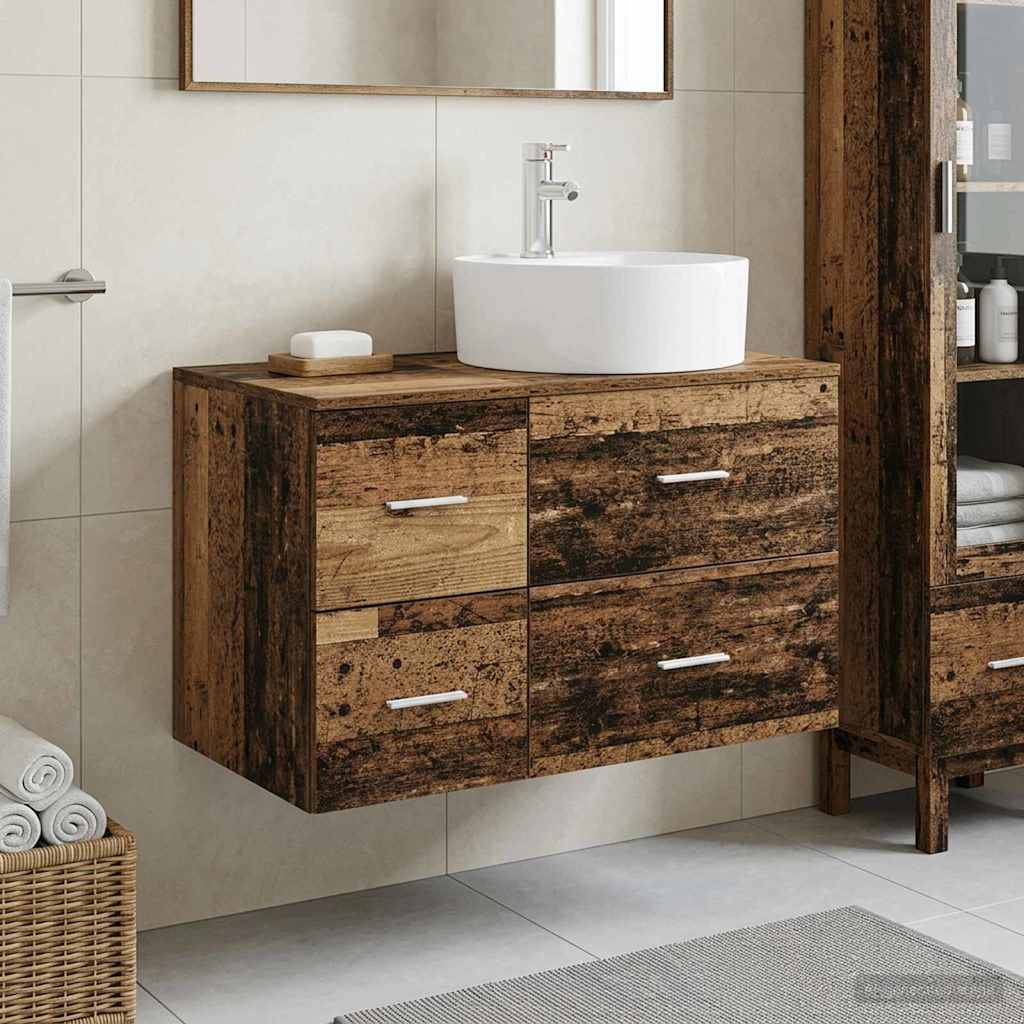 Modernes Badezimmerwaschtisch mit weißem Aufsatzwaschbecken auf einem rustikalen Holzschrank mit vier Schubladen, gezeigt vor gekachelten Wänden.