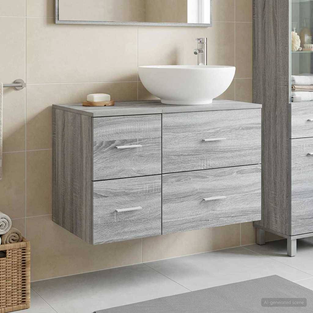 Modernes Badezimmer-Waschtisch mit hellgrauem Holzmaserung-Schubladen und einem weißen Aufsatzwaschbecken vor beige gefliesten Wänden.