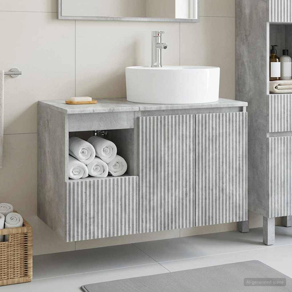 Modernes Badezimmermöbel mit rundem Aufsatzwaschbecken, betonoptimiertem Schrank, offener Handtuchtablette und passendem gestreiftem Lagerschrank neben einem Wandspiegel.