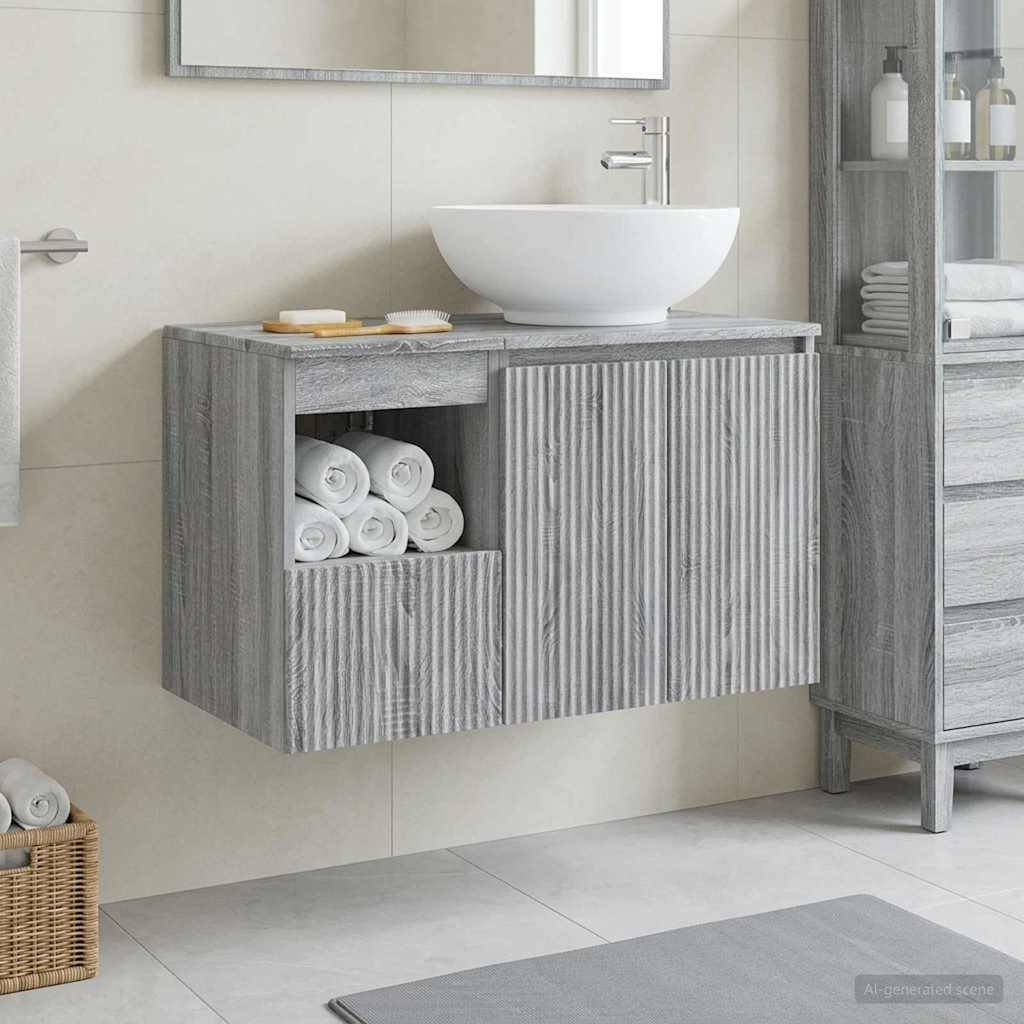 Modernes Badezimmerwaschtisch mit weißem Aufsatzwaschbecken und Chromarmatur, sowie offener Ablage mit aufgerollten Handtüchern.