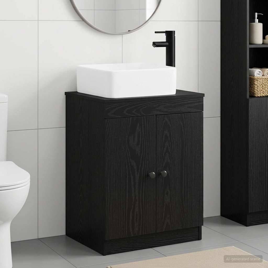 Modernes Badezimmerelement mit schwarzem Schrank, weißem Aufsatzwaschbecken und matter schwarzer Armatur neben einer Toilette.