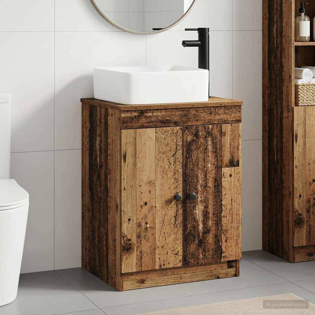 Rustikales Holz-Badezimmerwaschbecken mit weißem Aufsatzwaschbecken und schwarzem Wasserhahn neben einer Toilette und passendem Schrank.
