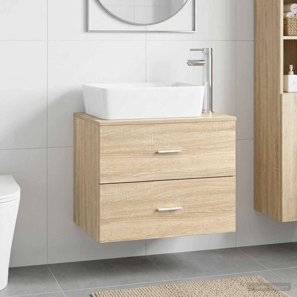 Modernes Badezimmer mit an der Wand montiertem Waschtischunterschrank aus hellem Holz, weißem Aufsatzwaschbecken, Chromarmatur, gekachelter Wand und grauem Boden.
