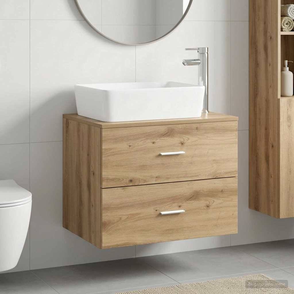 Modernes Badezimmermöbel mit weißem Aufsatzwaschbecken, verchromtem Wasserhahn und schwebendem Holzschrank unter einem runden Spiegel.
