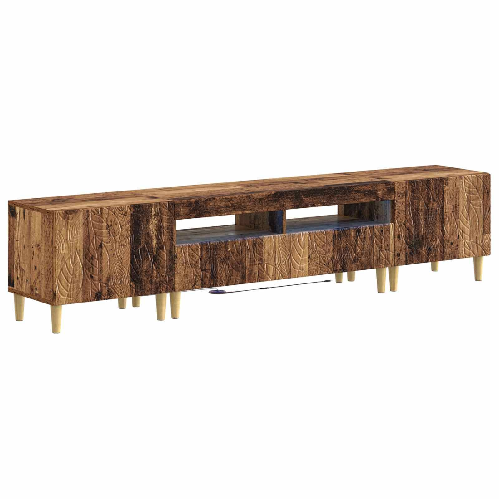 Langes Holz-TV-Möbel mit geschnitzter geometrischer Front, offener mittlerer Ablage und kurzen Goldbeinen auf weißem Hintergrund.