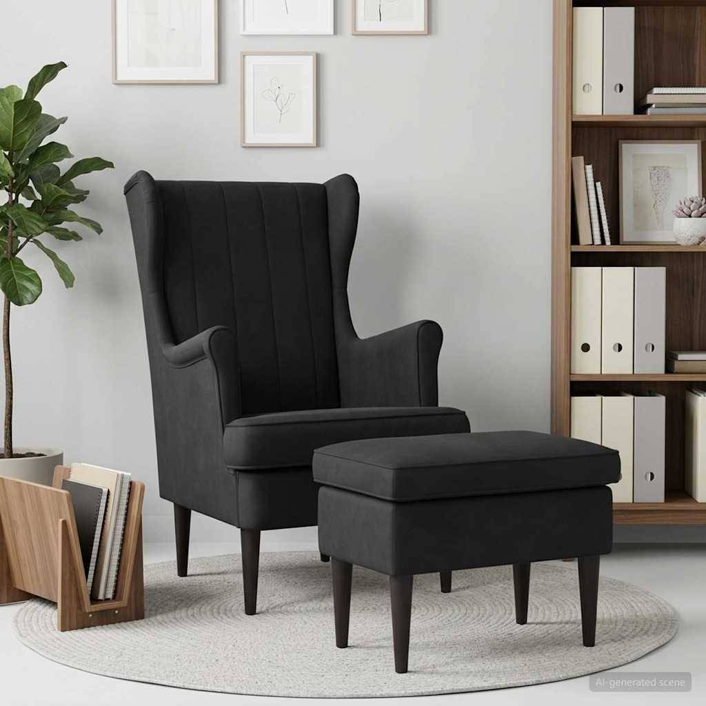 Dunkelgrauer Ohrensessel mit passendem Fußhocker in einem modernen Wohnzimmer, neben einer Pflanze, einem Bücherregal und gerahmten Wandbildern.