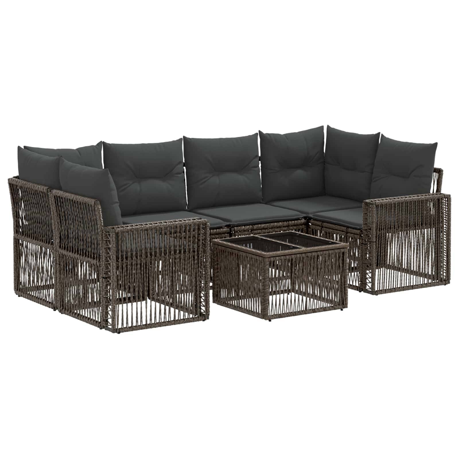 Modulares Gartensofaset aus Polyrattan mit dunklen Kissen und passendem niedrigen Couchtisch.