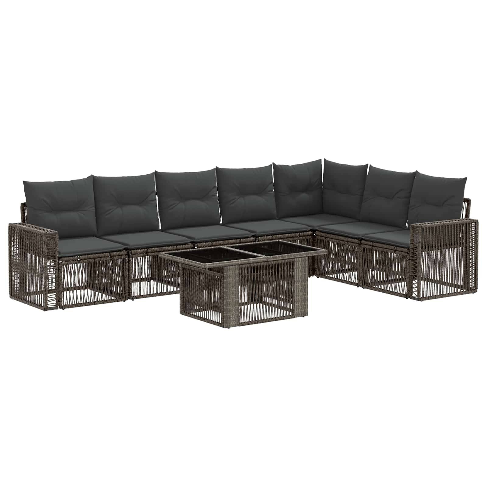 Braunes Rattan-L-förmiges Außenbereichs-Ecksofa mit dunklen Kissen und einem passenden Glastisch mit weißem Hintergrund