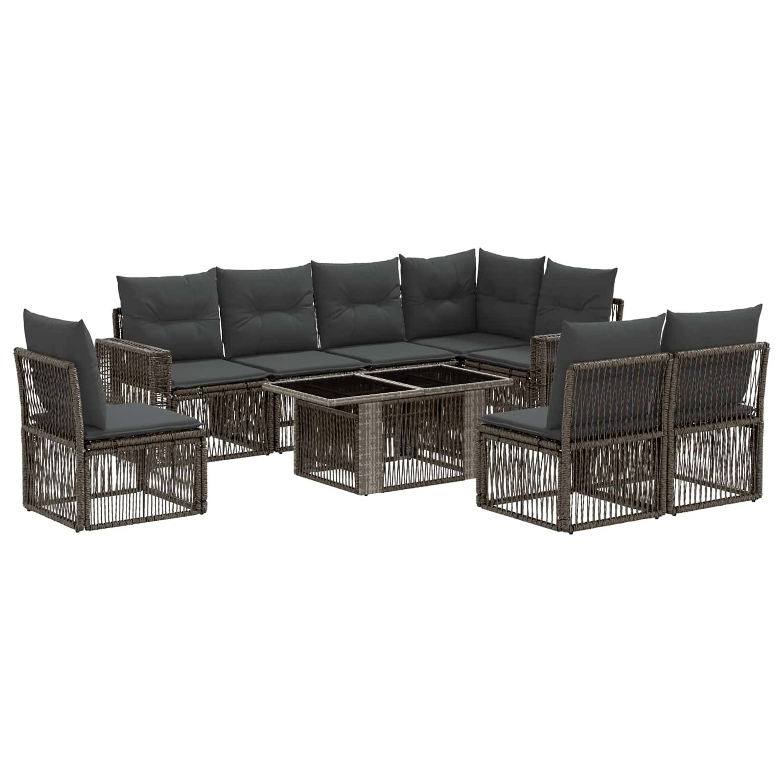 Dunkles Rattanmöbel-Garnitur für die Terrasse mit Ecksofa, zwei Sesseln und passenden Couchtischen mit grauen Kissen.